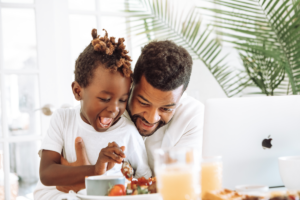 Father and son making food