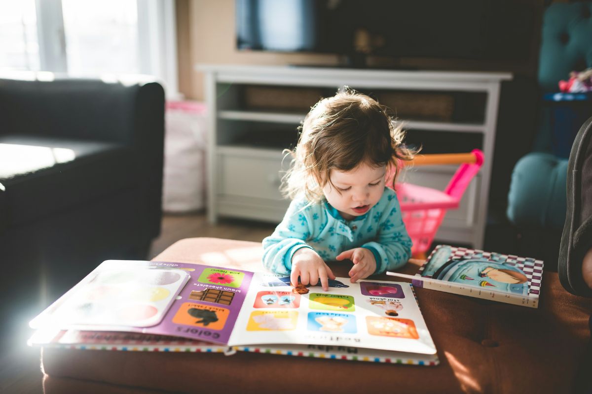 Toddler reading a book