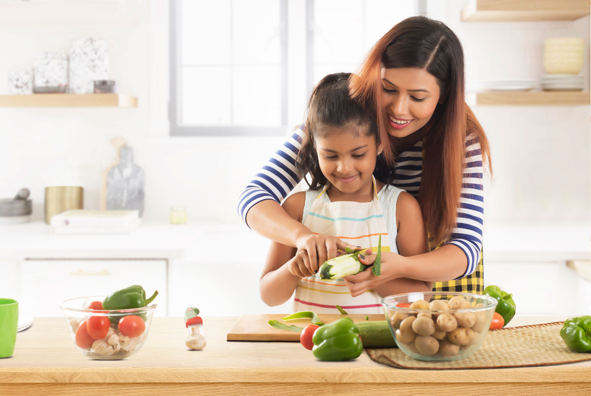 Mom and daughter cooking together in the kitchen