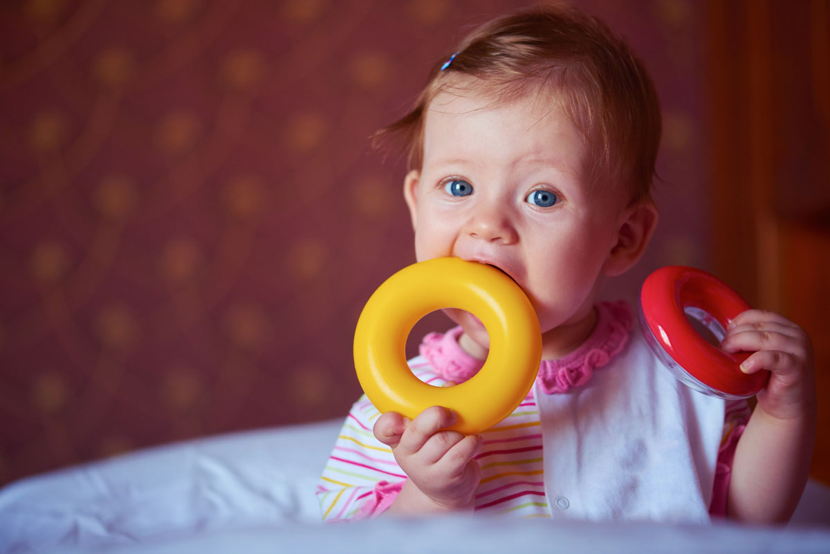 Baby with teething ring