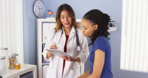 Woman speaking with healthcare practitioner